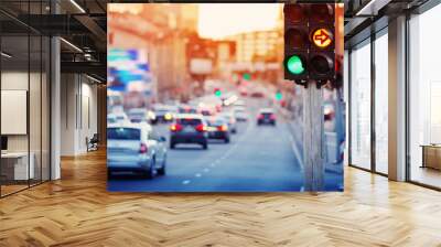 Cars moving on the road in city in late evening. View to the traffic with trafficlights and transport Wall mural