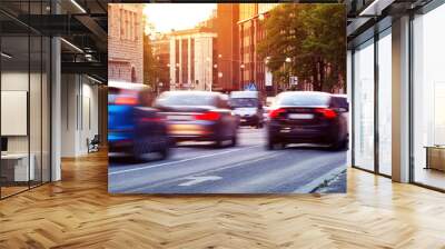 cars moving on the urban road at dusk in summer. transport in the city Wall mural