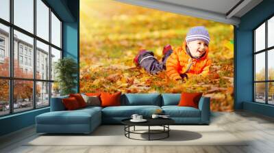 Child standing with umbrella in beautiful autumnal day Wall mural