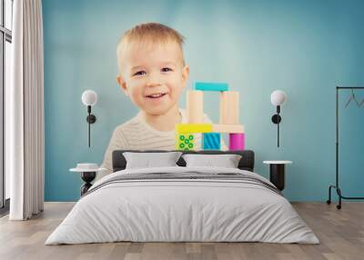 portrait of a two years old child sitting at the table Wall mural