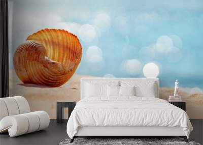 Shell on the sand of the sea beach in summer Wall mural