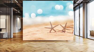 Starfishes on the beach sand in summer Wall mural