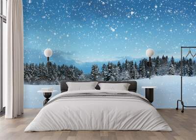 Trees in winter landscape in late evening in snowfall Wall mural