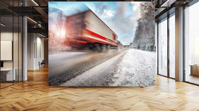 Truck on asphalt road in winter on sunny morning Wall mural