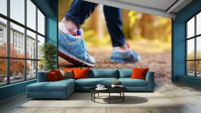 Young woman hiking and going camping in nature Wall mural