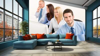 Business team happy sit in line behind table Wall mural