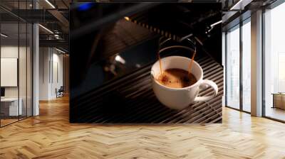 Espresso machine brewing coffee into a glass. Wall mural