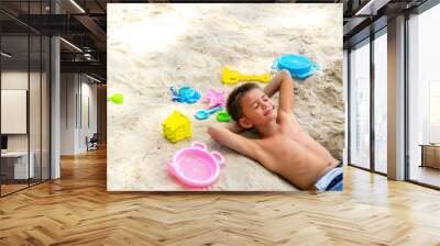 Happy children kid enjoy and fun outdoor lifestyle travel nature at the sea on summer beach holiday vacation. Portrait of Little cute child boy in swimwear relaxing on the beach in summer sunny day. Wall mural