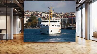 In Istanbul, ferries operate on the Bosphorus line. Traditional old steamers. Cloud weather in the background and the Anatolian side. Wall mural