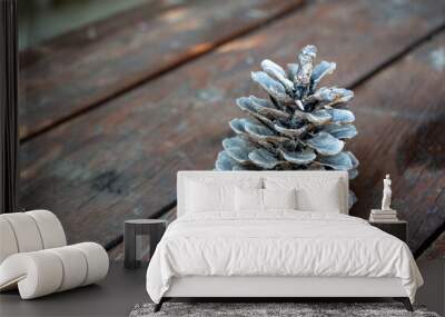 Pinecone on a wooden table with copy space for text. Pinecone on a wooden background. Wall mural