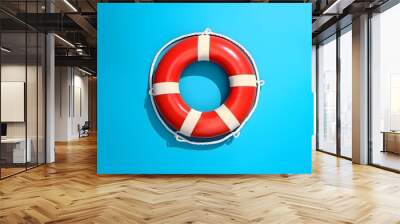 Lifebuoy on blue background with copyspace Wall mural