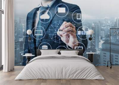 Double exposure of businessman connected devices with world digital technology internet and wireless network on touch screen and city of business background in business and technology concept Wall mural