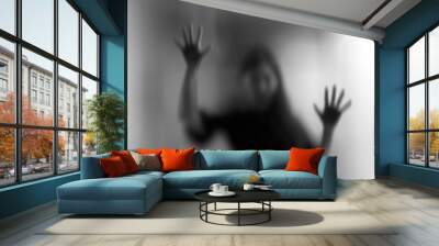 Horror woman behind the matte glass in black and white. Blurry hand and body figure abstraction Wall mural