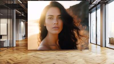 Smiling young brunette woman on the beach Wall mural