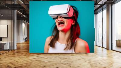 Young female having fun with virtual reality glasses. Young girl using new headset goggles trends technology Wall mural