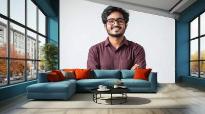 A young Indian entrepreneur standing confidently , who is smiling and wearing casual modern clothes, symbolizing innovation and success. Wall mural