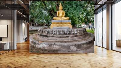 Luang Prabang, Laos - December 3, 2015:  Golden Buddha statue in Laos Wall mural