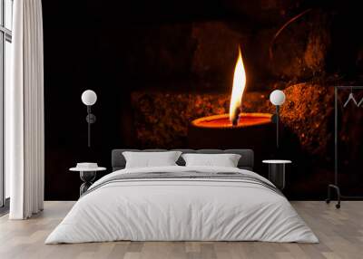 candle light on brick wall. Wall mural