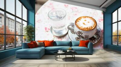 cup of cappuccino on table. Wall mural