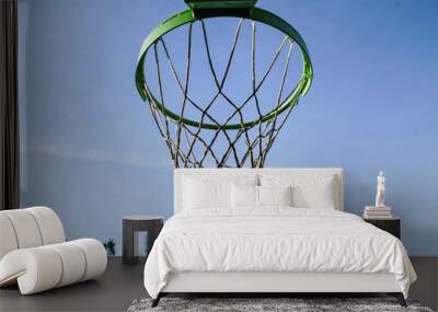 Sky's the Limit: A basketball hoop against a clear sky backdrop, inviting play and endless aspirations. Wall mural