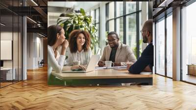 business people or coworkers gathered around a table working Wall mural