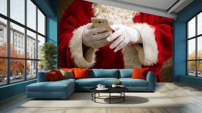 closeup of santa claus hands with mobile phone Wall mural