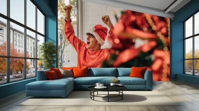 excited teenager boy at home on christmas Wall mural