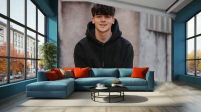 portrait of smiling teenager on the street outdoors Wall mural