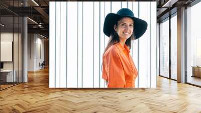 portrait of smiling young girl with hat Wall mural