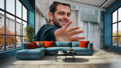 portrait of young man on the street Wall mural