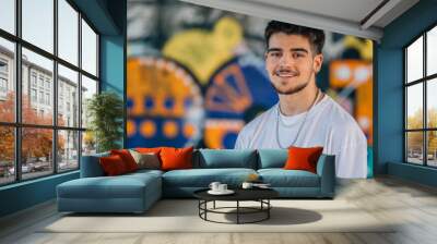 portrait young urban man smiling at camera Wall mural