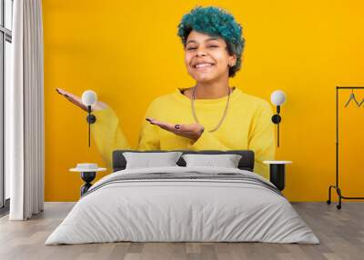 young girl or brunette woman with blue curls isolated on yellow background Wall mural