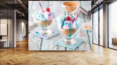 Two cotton candy sundaes topped with sprinkles and syrup. Wall mural