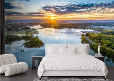 Aerial view of a beautiful morning sunrise sky and water reflection over the mountain and lake, marina and Bass Club on beautiful Tims Ford Lake in Winchester Tennessee Wall mural