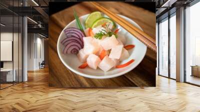 Ceviche bow on wood background. Raw fish with onions, lime and red pepper. Wall mural