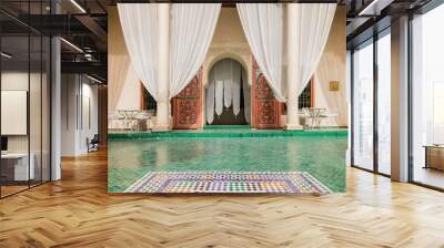 Elegant courtyard at Le Jardin Secret Marrakech with green mosaic tiles, white curtains, intricate Moroccan design, traditional architecture Wall mural