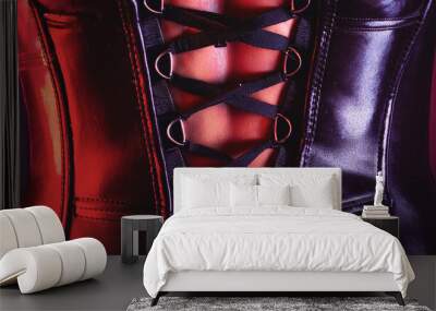 Metallic purple leather corset with intricate lace-up detailing, sexy lingerie close-up background for fashion and fetish wear, bondage and dominatrix themes. Wall mural