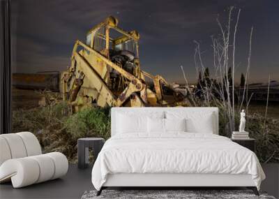 abandoned excavator in the middle of nowhere with stars in the background Wall mural