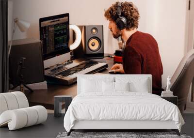 Music producer working at home music studio Wall mural