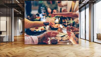 family sitting at the table - vegan friends having dinner together - fucus in the foreground Wall mural