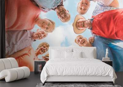 senior people having fun - bottom view of happy older people in a circle - friendship and leisure at the third age Wall mural