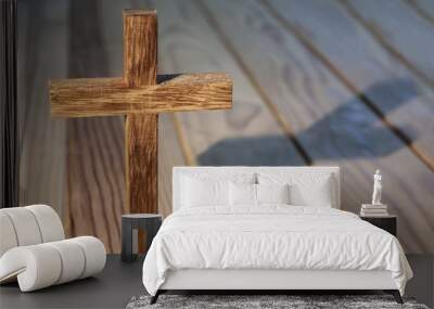 cross on wood table background Wall mural