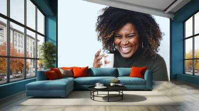 Closeup Smiling African American Black Woman with curly hair holding a coffee cup Wall mural