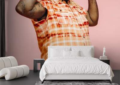 Happy plus size man dancing with arms up, feeling great Wall mural