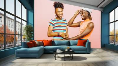 Having fun in a relationship  - portrait of two men holding hands and having a big laugh Wall mural