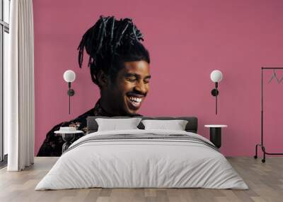 Portrait of a laughing man with cool hair and eyes closed Wall mural