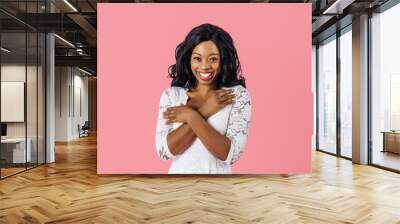 Portrait of  young happy woman in white lace dress looking at camera with a sweet smile and arms crossed Wall mural