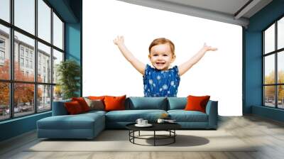 studio portrait of smiling girl with arms raised Wall mural