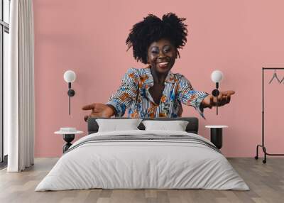 Stylish African American woman dancing with arms open smiling and looking at the camera Wall mural