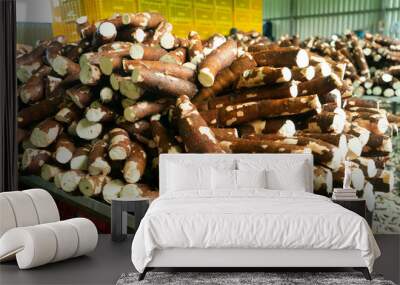 Pile of cassava in a food processing plant Wall mural